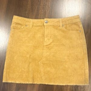 Yellow corduroy cutoff midi-length skirt